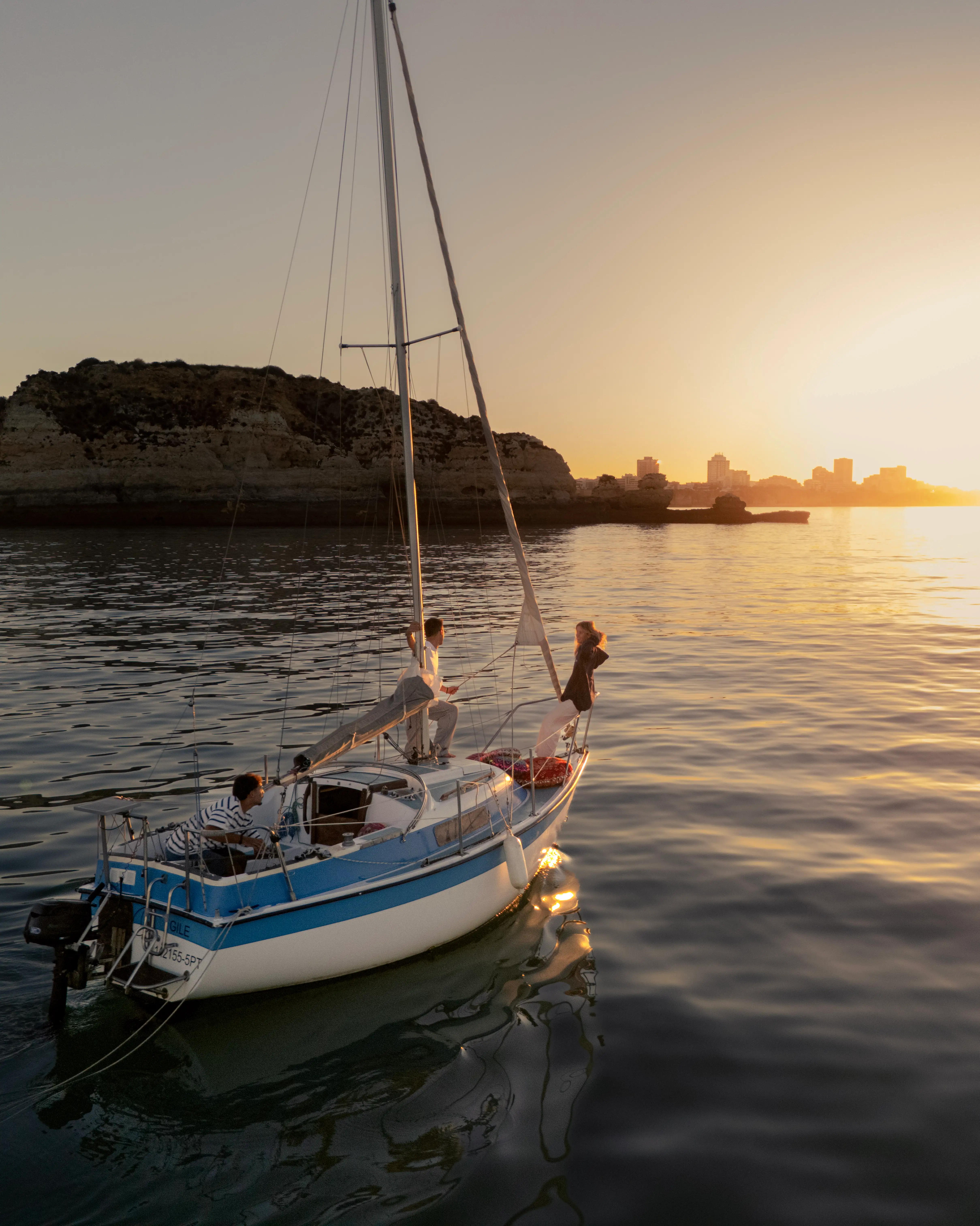 Couple enjoying a private sunset boat tour in the Algarve